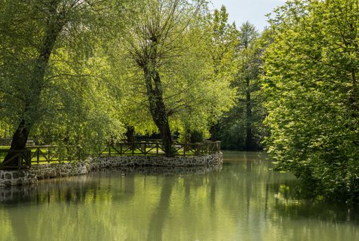 Calm and peaceful river in the park by Postojnska Jama in Slovenia