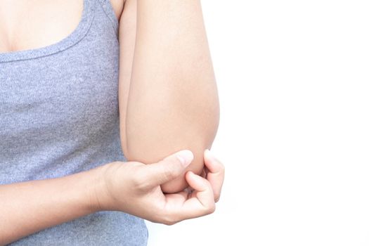 Closeup woman hand holding elbow with pain on white background, health care and medical concept 