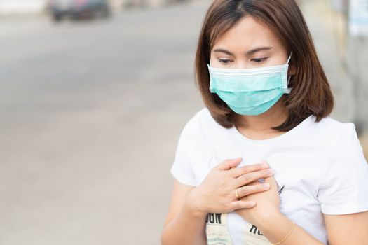 Closeup woman wearing face mask for protect air polution, health care and medical concept