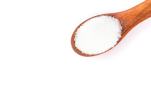 Monosodium glutamate in wood spoon on white background, food ingredient