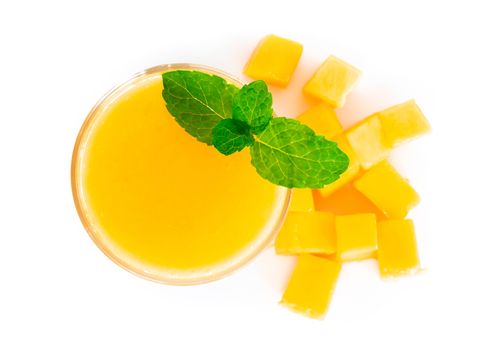 Closeup glass of mango fruit juice isolated on white background