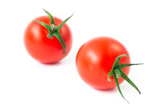 Fresh colorful cherry tomatoes on white background, raw food and vegetable concept