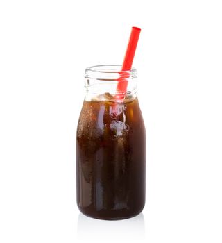 Ice of americano in glass bottle isolated on white background