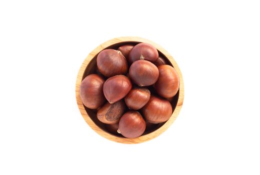 Closeup horse chestnuts in wood bowl isolated on white background,  healthy food concept