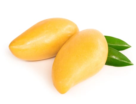 Closeup ripe mango tropical fruit with leaves isolated on white background