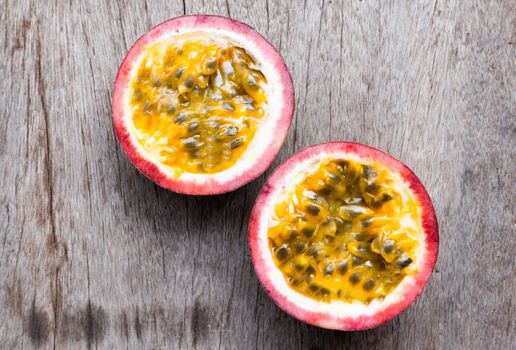 Closeup passion fruit with slice on wooden background, fruit healthy concept