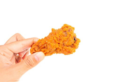 Close up woman  hand holding fried chicken leg isolated on whit background