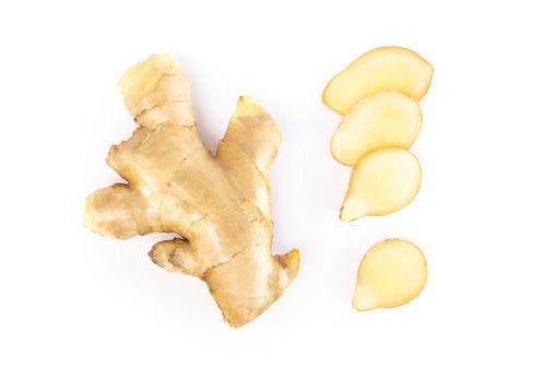 Fresh ginger root sliced on white background for herb and medical product concept