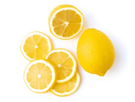 Closeup fresh lemon fruit slice isolated on white background, food and healthy concept