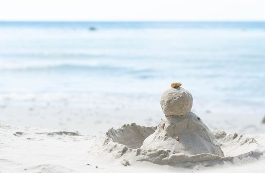 Closeup sand and stone pile on the beach with water  for holiday and relax conept