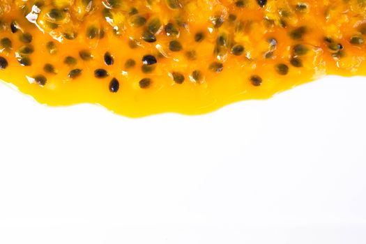 Closeup top view passion fruit seed on white background with copy space, fruit for healthy concept