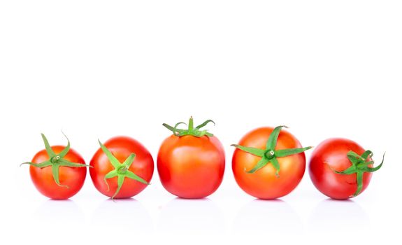 Closeup fresh tomato on white background, raw food and vegetable for health