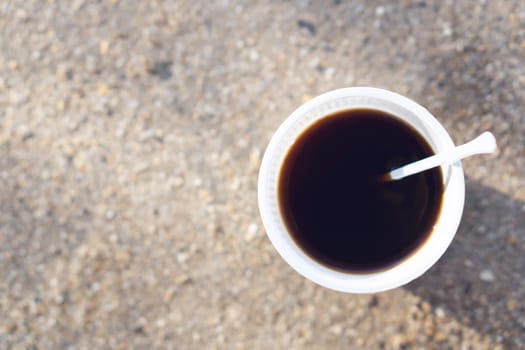 Closeup top view cup of hot americano coffee with soft light from sun in the morning, Relax time concept