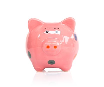 Pink piggy bank isolated on white background