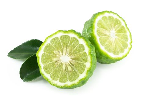 Fresh bergamot fruit slice with green leaf isolated on white background, herb and medical