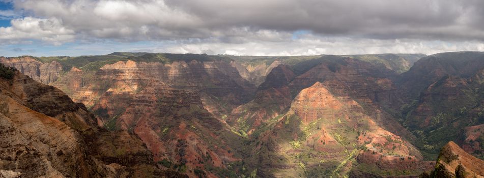 Colorful red rocks in the grand Waimea Canyon on the hawaiian island of Kauai