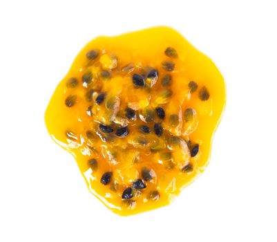 Closeup top view passion fruit seed drop on white background, fruit for healthy concept