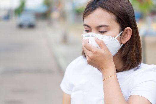 Closeup woman wearing face mask for protect air polution, health care and medical concept