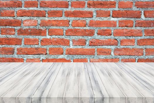 White wooden table top on brick wall. For product display