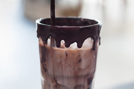 Ice coffee on wooden table, stock photo