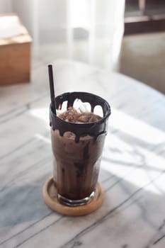 Ice coffee on wooden table, stock photo