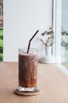 Ice coffee on wooden table, stock photo