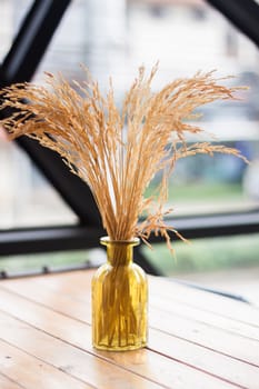 Bouquet of dried flowers in vase on table, stock photo