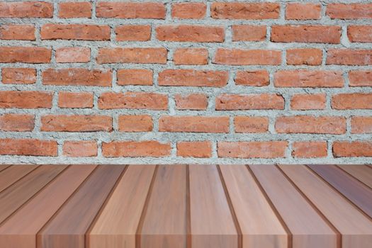 Brown wooden table top on brick wall. For product display