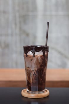 Ice coffee on wooden table, stock photo