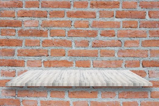 Top of white wooden shelf on brick wall. For product display