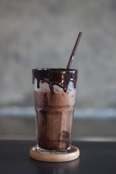 Ice coffee on wooden table, stock photo