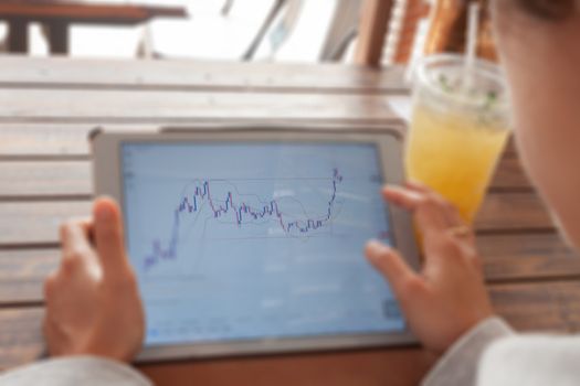 Woman hand trading online on tablet, stock photo