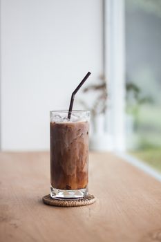 Ice coffee on wooden table, stock photo