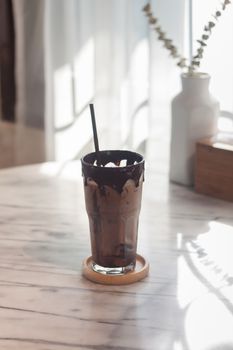 Ice coffee on wooden table, stock photo