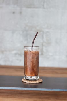 Ice coffee on wooden table, stock photo