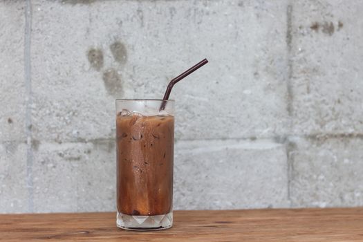 Ice coffee on wooden table, stock photo