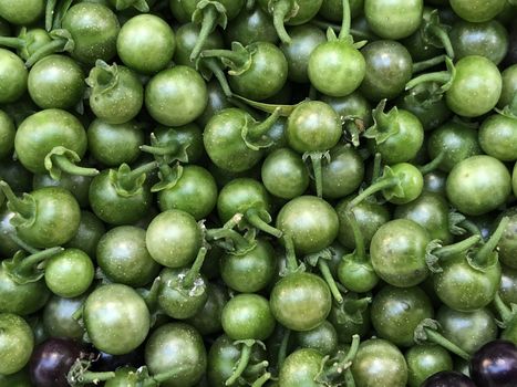 Wonder berry fruits are kept in the clusters before cooking in a plate