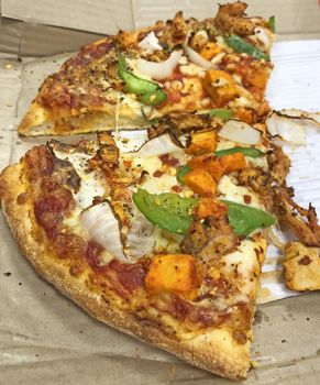 Beautiful view of sliced chicken pizza served in the restaurant for eating