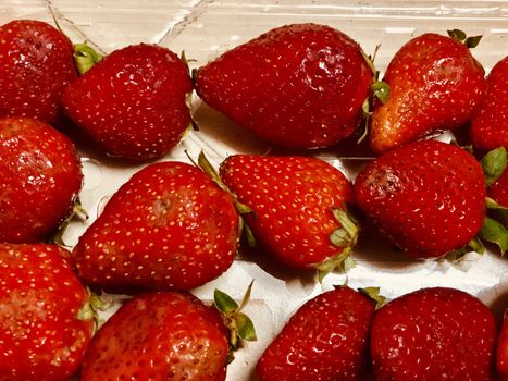 Beautiful view of red color strawberry fruit kept for sale in the market