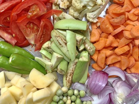 Top view of variety of colorful vegetables kept in a plate for preparing lunch
