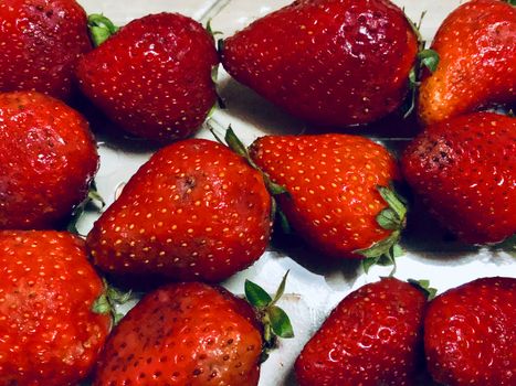 Beautiful view of red color strawberry fruit kept for sale in the market
