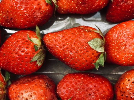 Beautiful view of red color strawberry fruit kept for sale in the market