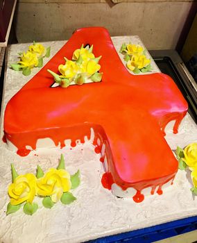 Beautiful decoration of a birthday cake during the celebration in the birthday party