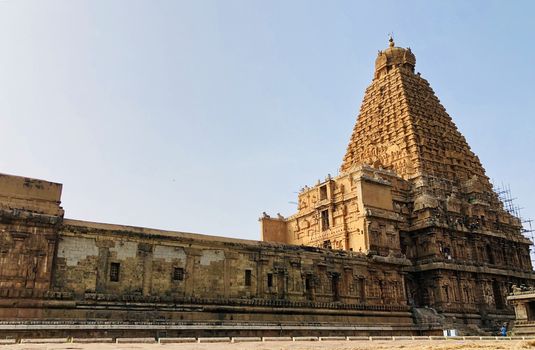 The Brihadisvara temple or Brihadeeswar temple located in Thanjavur, Tamilnadu built by Tamil King Raja Raja Chola-I between 1003 and 1010 AD. This is the Hindu temple built in Dravidian architecture style. The temple is entirely built with granite stones and the temple contains many monolithic sculptures in it. This temple is one of the `Great Living Chola Temples` and also tamil words are inscribed in the wall of the temple. This temple is dedicated to Lord shiva and it is a UNESCO World Heritage Site.