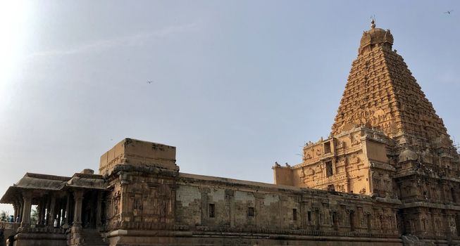 The Brihadisvara temple or Brihadeeswar temple located in Thanjavur, Tamilnadu built by Tamil King Raja Raja Chola-I between 1003 and 1010 AD. This is the Hindu temple built in Dravidian architecture style. The temple is entirely built with granite stones and the temple contains many monolithic sculptures in it. This temple is one of the `Great Living Chola Temples` and also tamil words are inscribed in the wall of the temple. This temple is dedicated to Lord shiva and it is a UNESCO World Heritage Site.