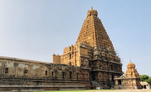 The Brihadisvara temple or Brihadeeswar temple located in Thanjavur, Tamilnadu built by Tamil King Raja Raja Chola-I between 1003 and 1010 AD. This is the Hindu temple built in Dravidian architecture style. The temple is entirely built with granite stones and the temple contains many monolithic sculptures in it. This temple is one of the `Great Living Chola Temples` and also tamil words are inscribed in the wall of the temple. This temple is dedicated to Lord shiva and it is a UNESCO World Heritage Site.
