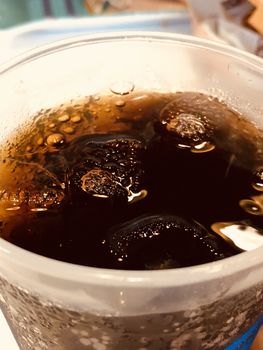 Beautiful view of Coke drinks with ice cubes in the glass