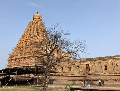The Brihadisvara temple or Brihadeeswar temple located in Thanjavur, Tamilnadu built by Tamil King Raja Raja Chola-I between 1003 and 1010 AD. This is the Hindu temple built in Dravidian architecture style. The temple is entirely built with granite stones and the temple contains many monolithic sculptures in it. This temple is one of the `Great Living Chola Temples` and also tamil words are inscribed in the wall of the temple. This temple is dedicated to Lord shiva and it is a UNESCO World Heritage Site.
