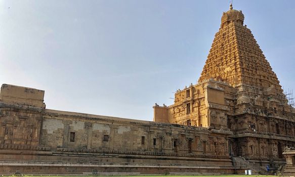 The Brihadisvara temple or Brihadeeswar temple located in Thanjavur, Tamilnadu built by Tamil King Raja Raja Chola-I between 1003 and 1010 AD. This is the Hindu temple built in Dravidian architecture style. The temple is entirely built with granite stones and the temple contains many monolithic sculptures in it. This temple is one of the `Great Living Chola Temples` and also tamil words are inscribed in the wall of the temple. This temple is dedicated to Lord shiva and it is a UNESCO World Heritage Site.