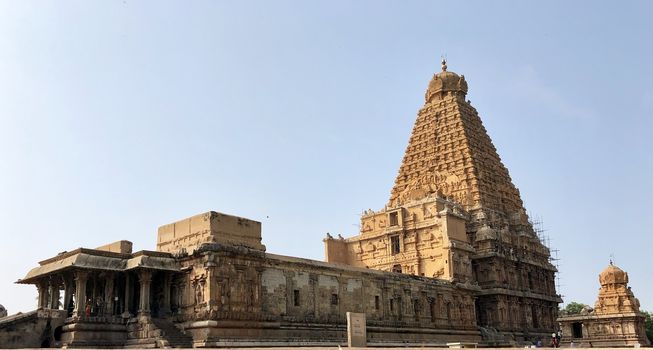 The Brihadisvara temple or Brihadeeswar temple located in Thanjavur, Tamilnadu built by Tamil King Raja Raja Chola-I between 1003 and 1010 AD. This is the Hindu temple built in Dravidian architecture style. The temple is entirely built with granite stones and the temple contains many monolithic sculptures in it. This temple is one of the `Great Living Chola Temples` and also tamil words are inscribed in the wall of the temple. This temple is dedicated to Lord shiva and it is a UNESCO World Heritage Site.